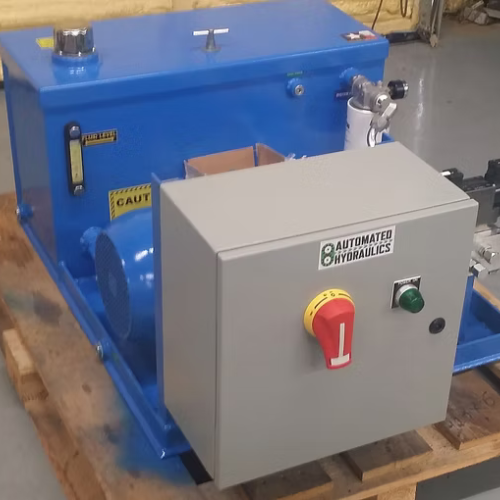 Blue industrial hydraulic machine with control panel and caution label